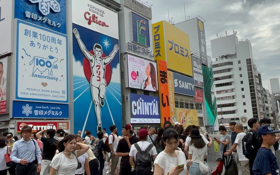 Many people walk in Dotonbori District.
